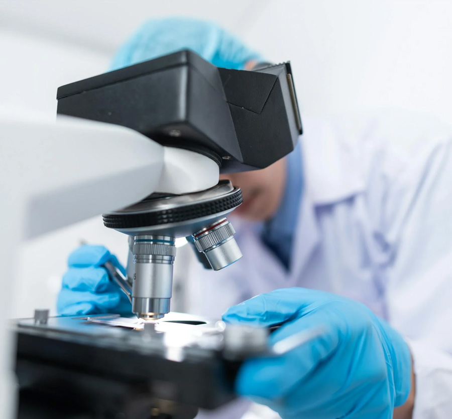 Scientist Looking at Slide